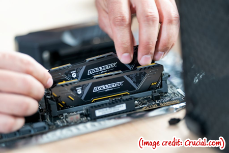 Some guy installing more RAM in a gaming PC